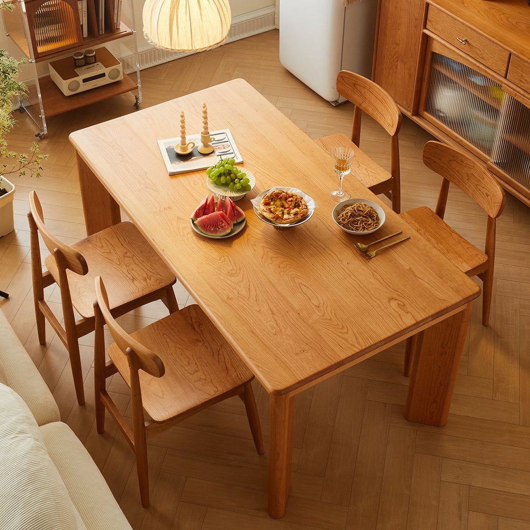 Loft Home wooden dining table set with matching chairs, styled with vibrant fruits and dishes in a cozy natural wood-themed dining space, enhancing warm and inviting family gatherings.