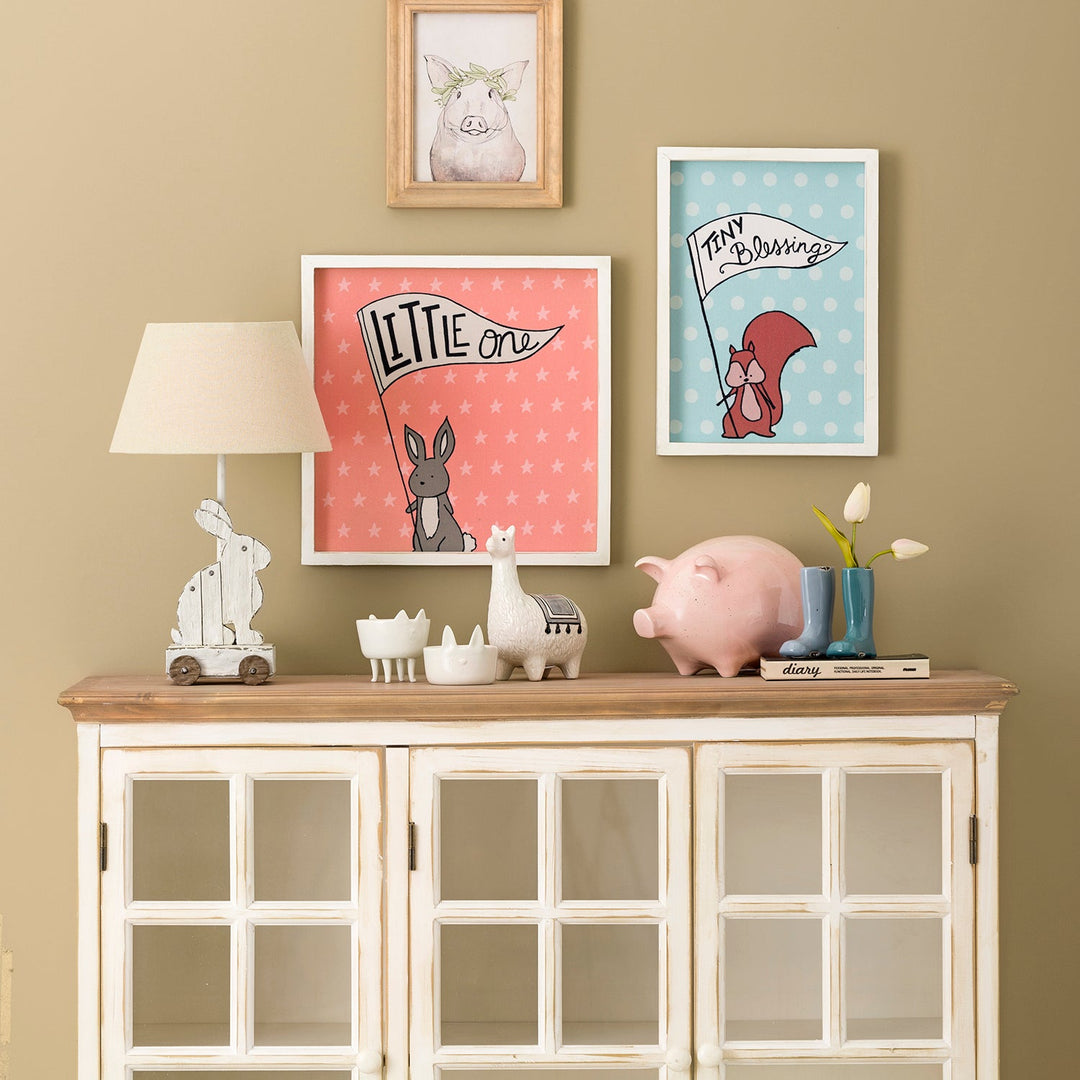 Loft Home vintage-style white storage cabinet with glass-paneled doors, adorned with playful decor, perfect for kids’ room organization.