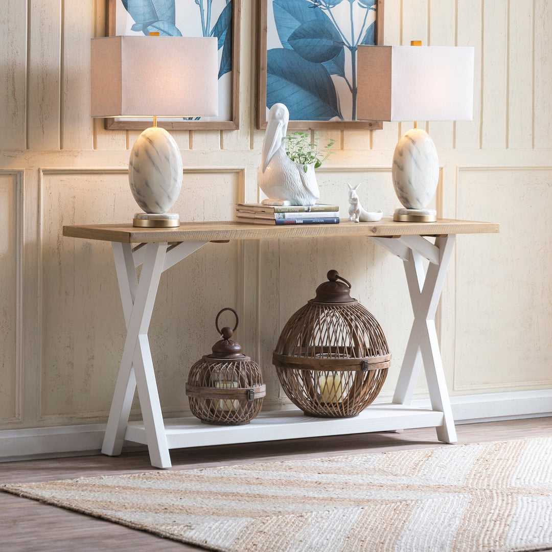Loft Home New Arrival Tables Collection - Contemporary console table with a rustic oak top and white cross legs, adorned with decorative lamps and wicker lanterns for a stylish entryway setup