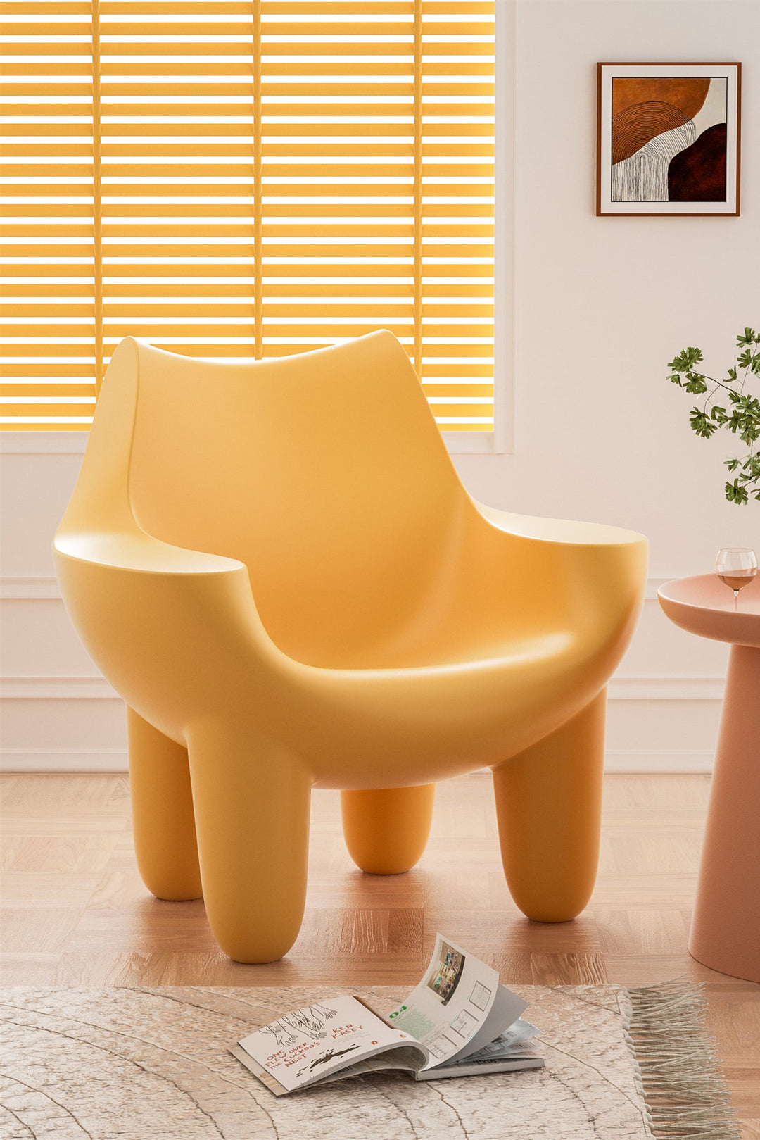 Yellow plastic single-seater sofa chair in a room with a window and a small table. Loft Home Singapore featured product for plastic material sofas.
