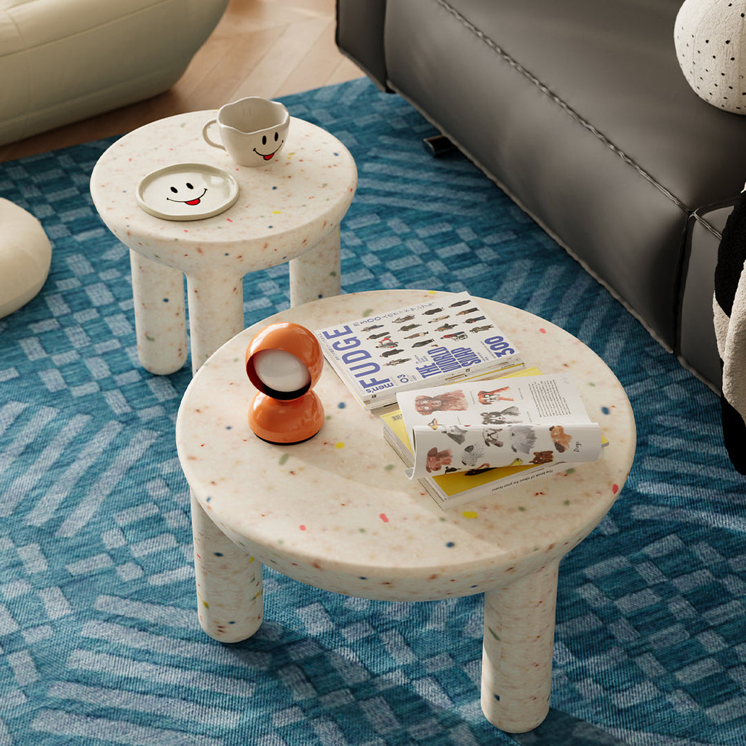 Loft Home playful round plastic tables with colorful terrazzo patterns, featuring sturdy cylindrical legs, ideal for adding a fun and vibrant touch to modern living spaces.