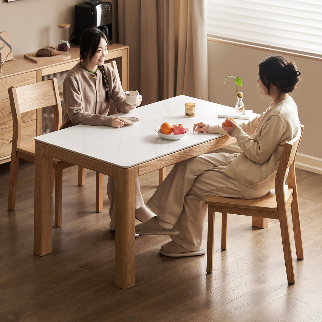 Loft Home Top Selling Tables Collection - Modern dining table with a sleek marble top and sturdy oak legs, blending functionality and style for everyday dining
