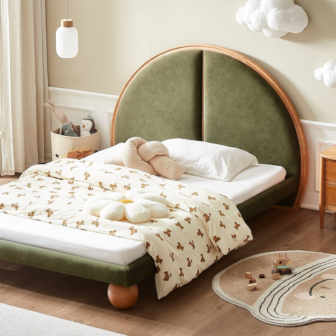 Loft Home US super single bed frame with an arched green upholstered headboard and playful wooden ball feet, styled with whimsical bedding and cloud-themed decor, enhancing a cozy and imaginative children’s bedroom.