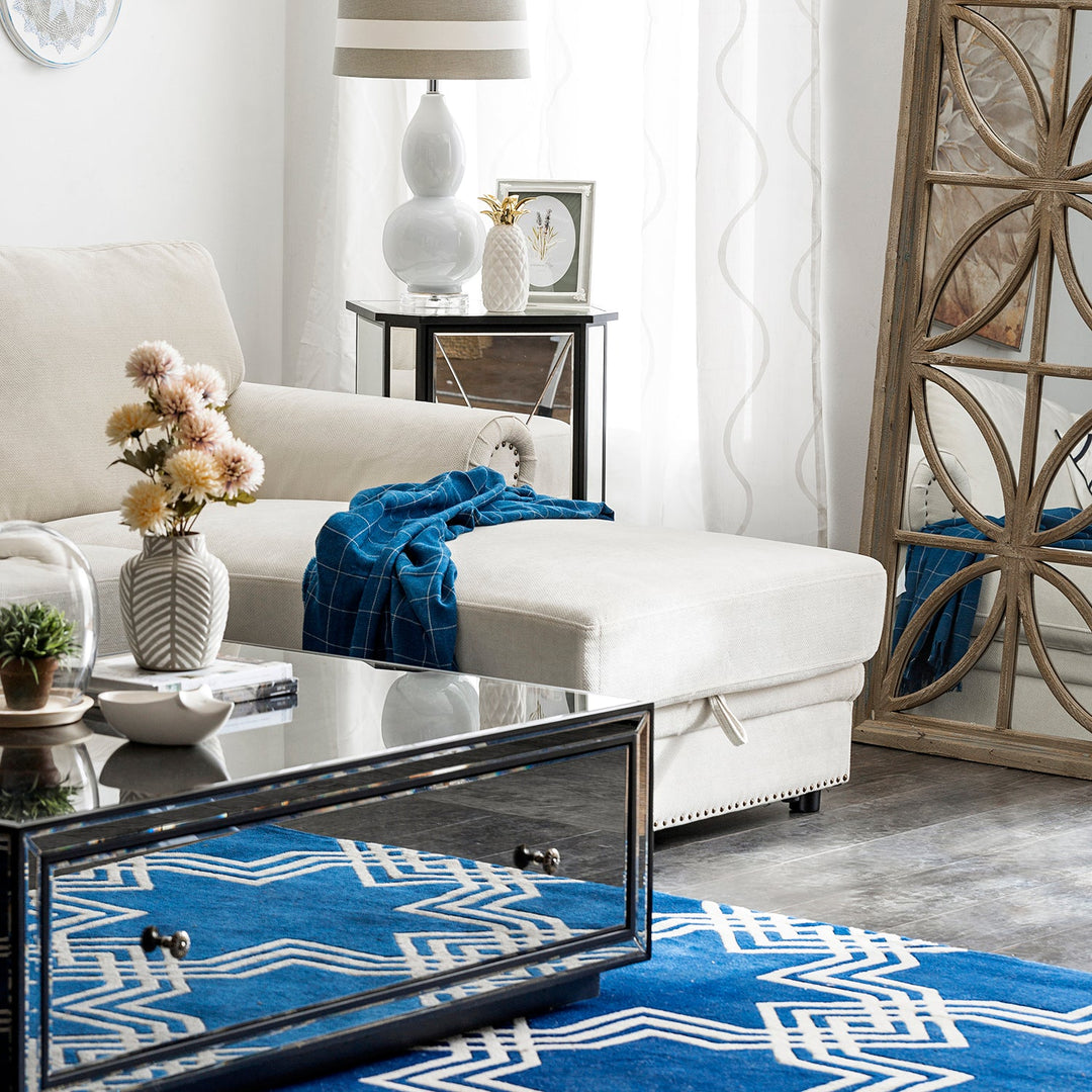 Loft Home sectional sofa in a modern living room setting, complemented by a mirrored coffee table and blue geometric rug, ideal for stylish comfort.