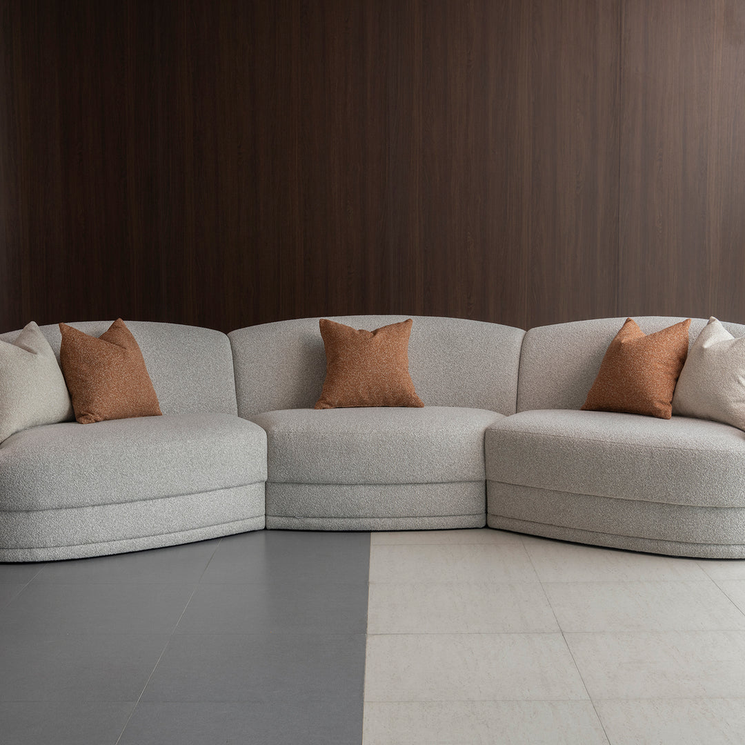 Modern boucle fabric modular sectional 5 seater sofa curva in panoramic view.