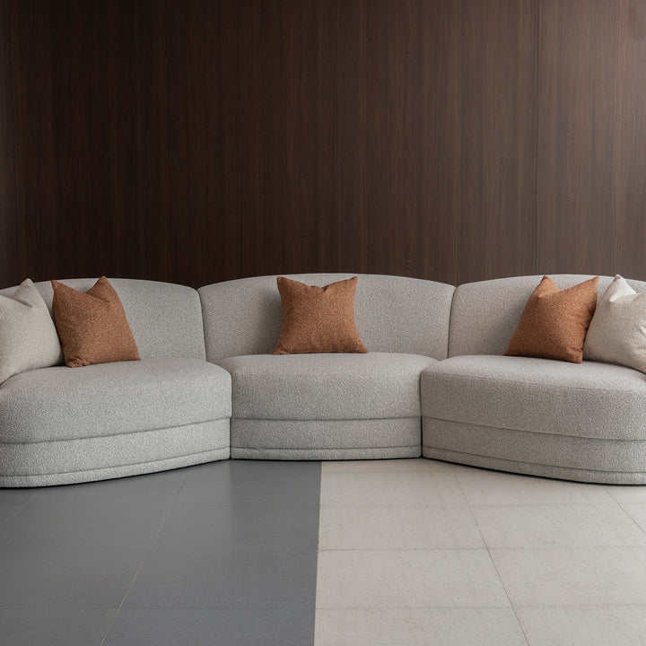 Modern boucle fabric modular sectional 5 seater sofa curva in panoramic view.