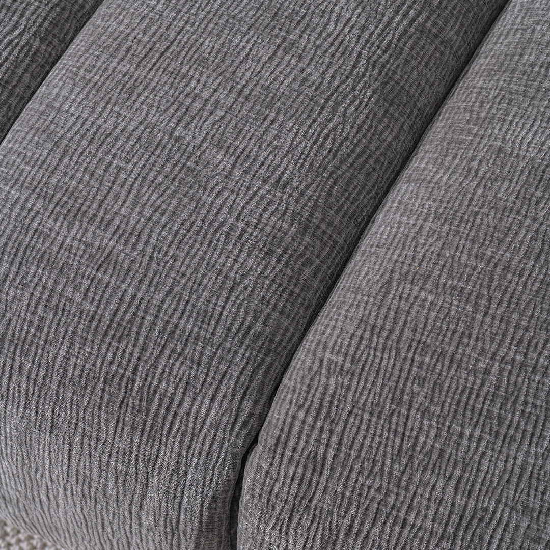 Modern velvet fabric 2 seater sofa raven in close up details.