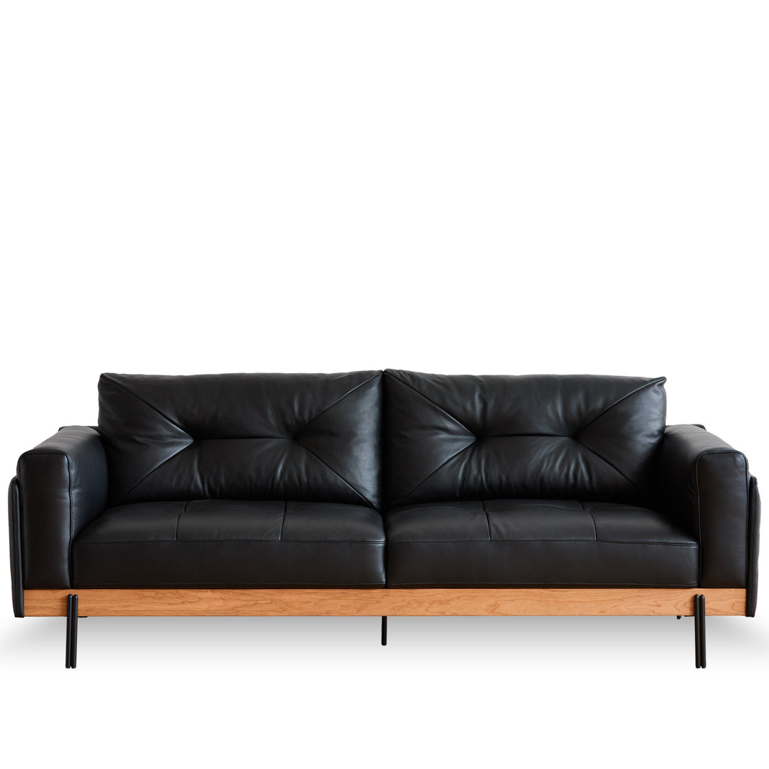 Scandinavian microfiber leather 3 seater sofa black in white background.
