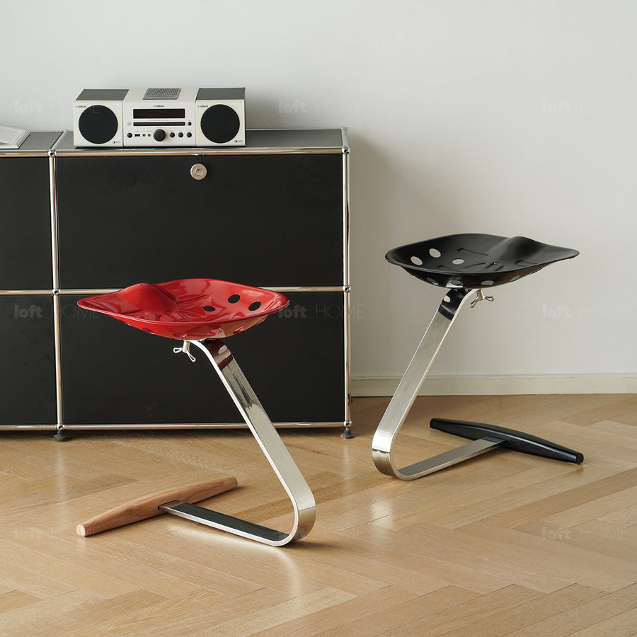 Industrial steel stool mezzadro in white background.