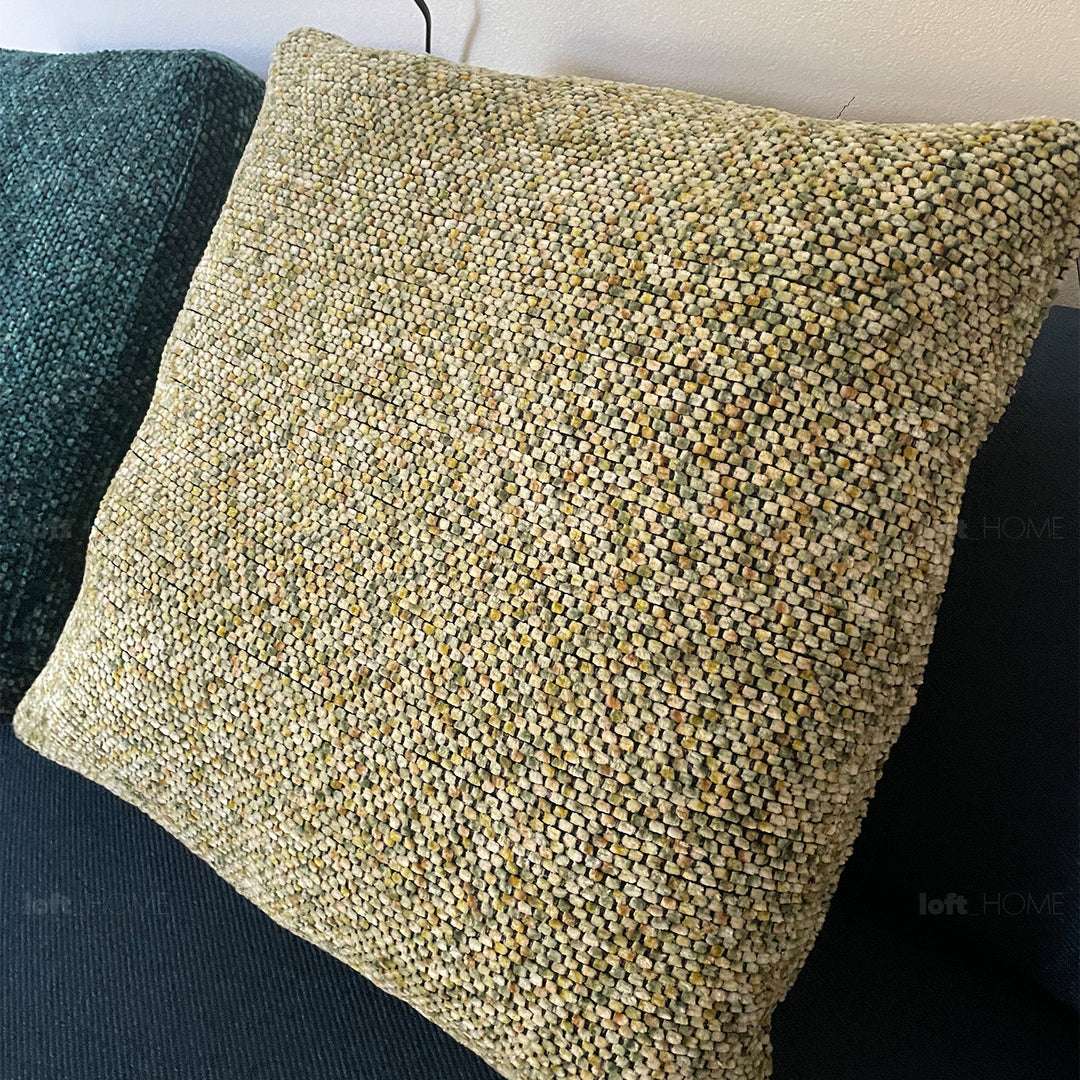 Minimalist fabric sofa pillow summer green in real life style.