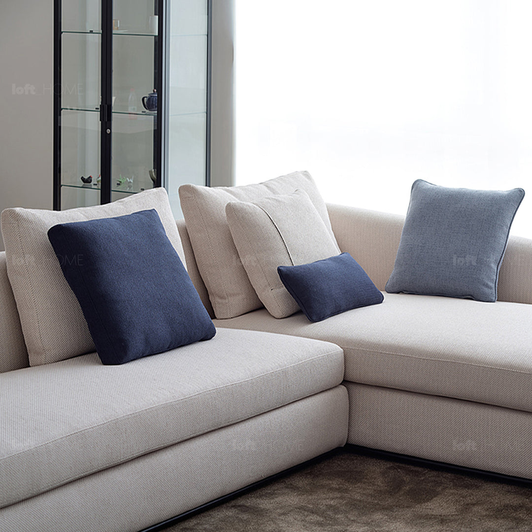 Minimalist fabric sofa pillow pale blue material variants.