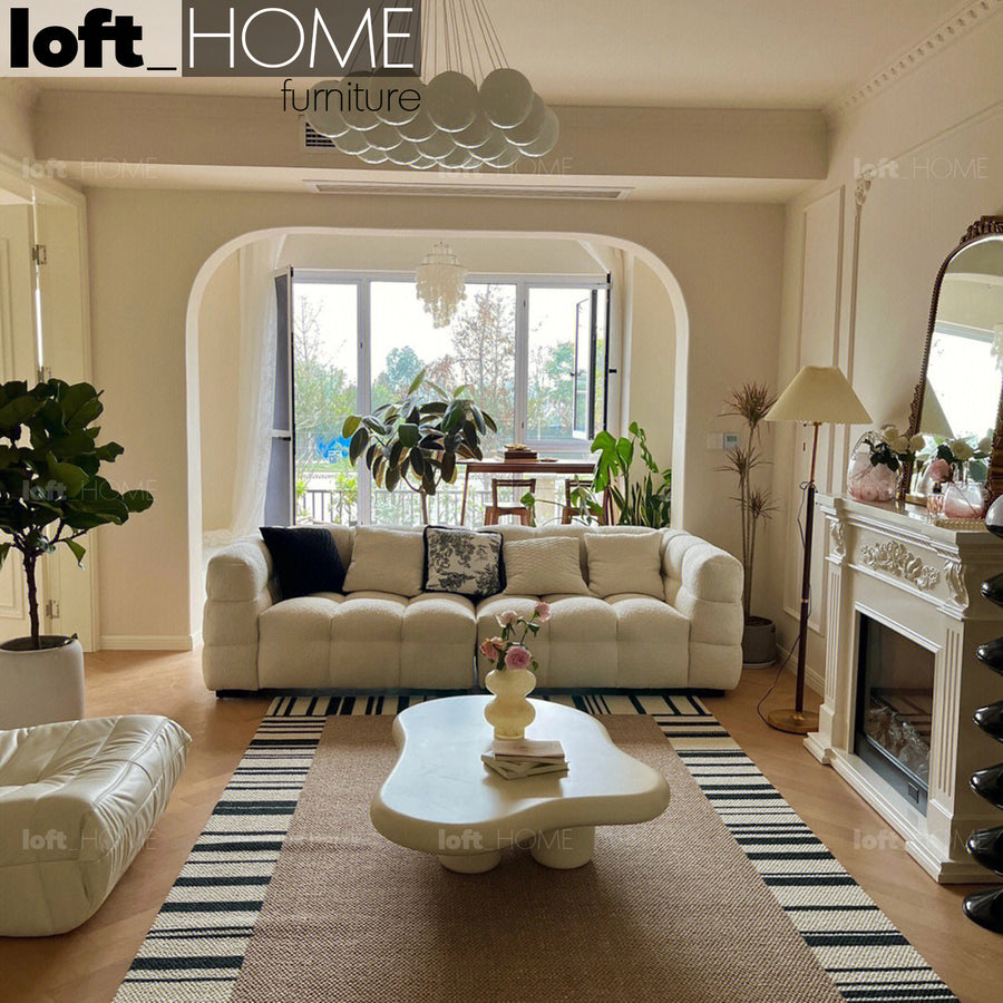 Cream boucle fabric 2 seater sofa boba in white background.