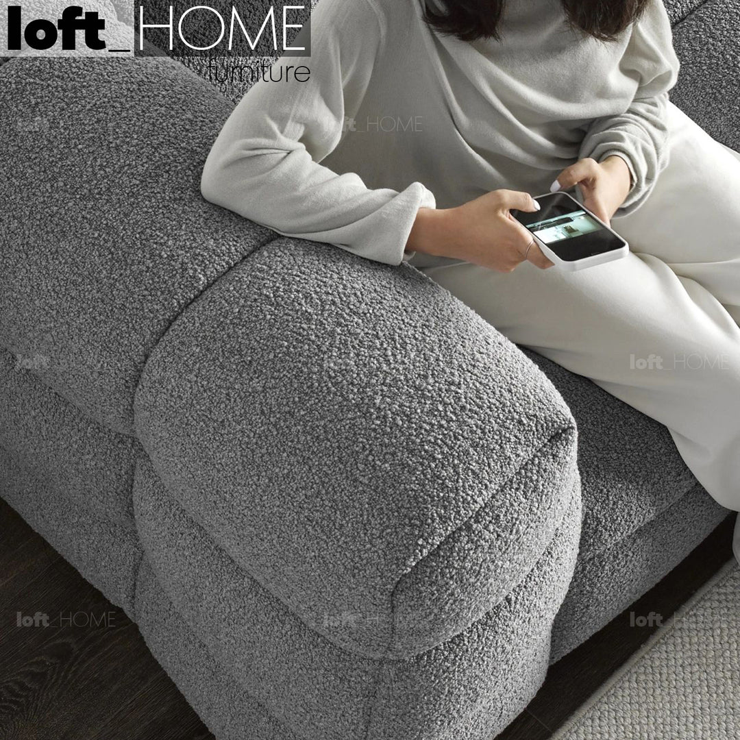 Cream boucle fabric 2 seater sofa boba in still life.