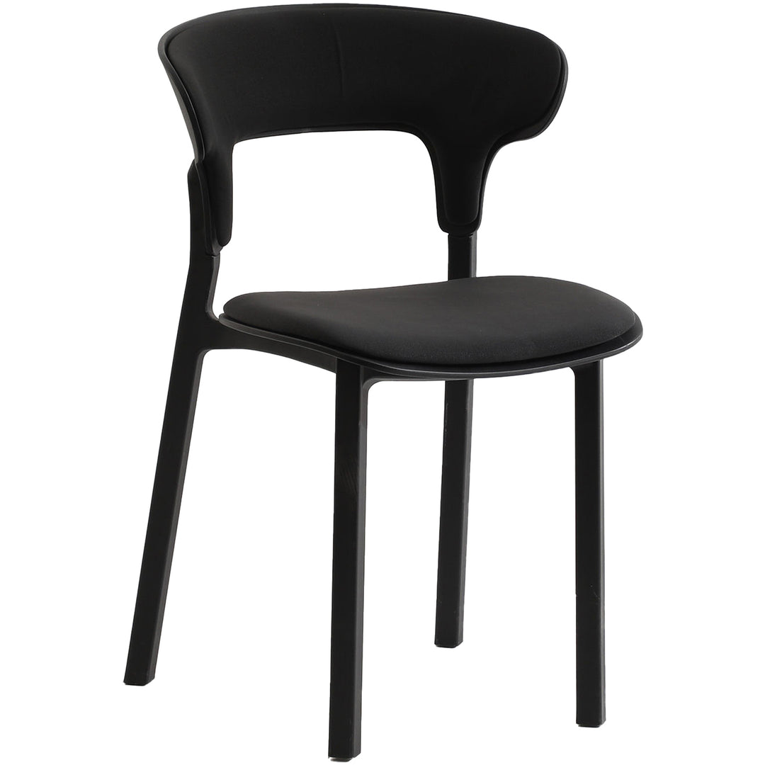 Contemporary fabric plastic dining chair hug in still life.