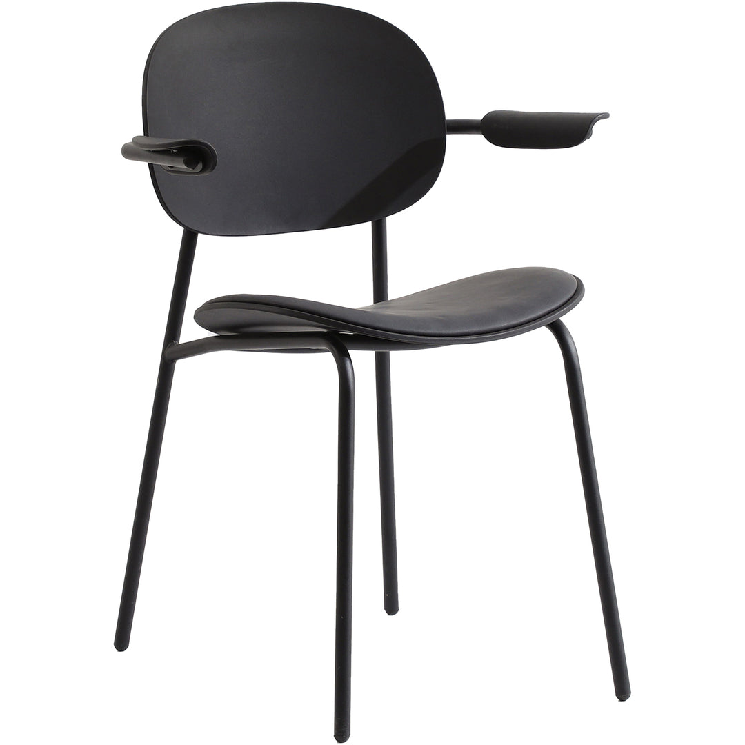 Contemporary fabric plastic dining chair loop in still life.