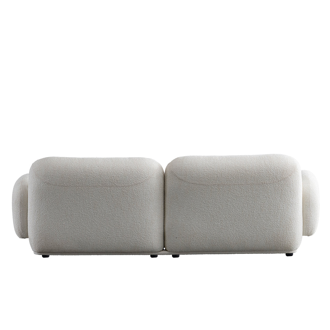 Cream boucle fabric 3 seater sofa pluum with context.
