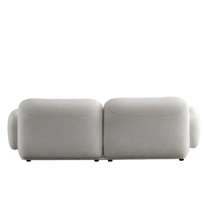 Cream boucle fabric 3 seater sofa pluum with context.