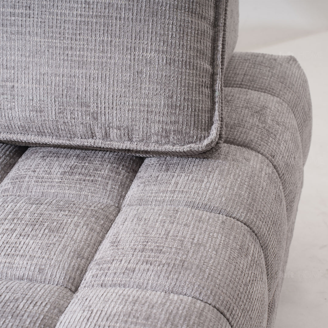 Cream fabric 1 seater sofa ganache in close up details.