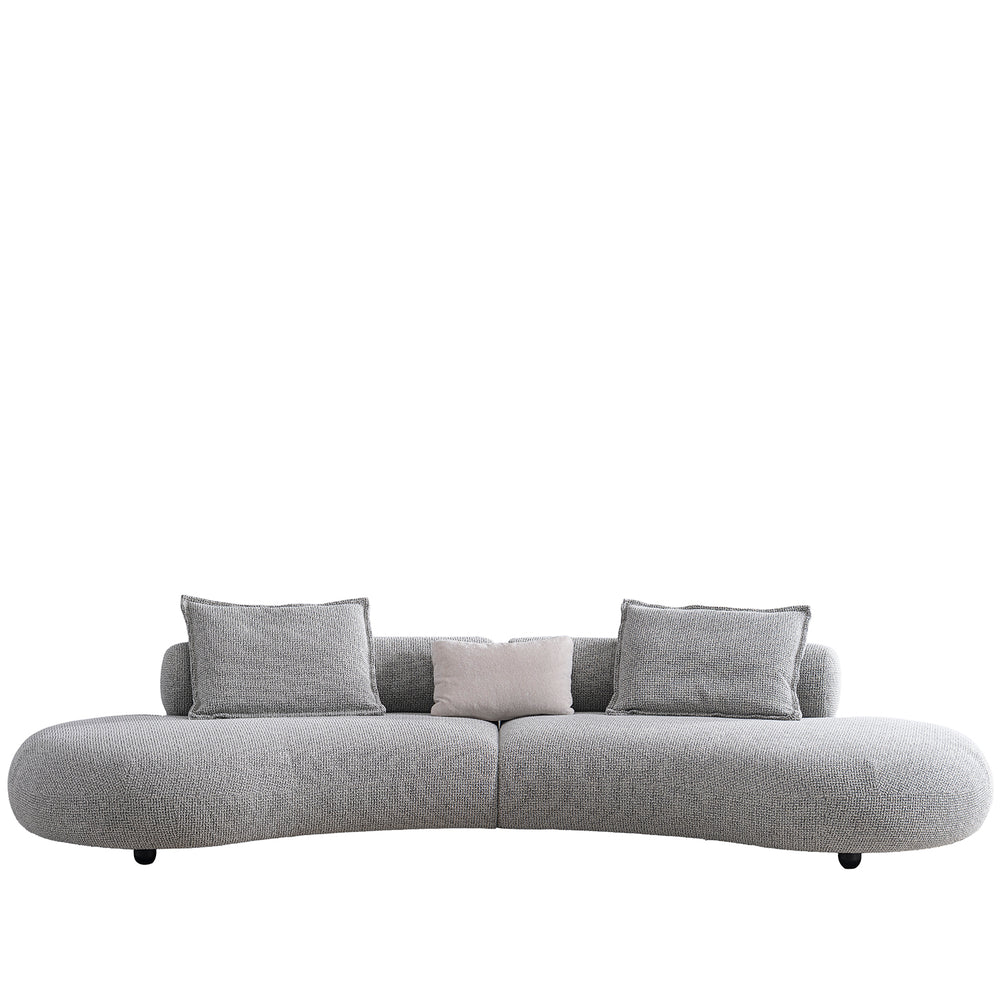 Cream mixed weave fabric 6 seater sofa curvo in white background.