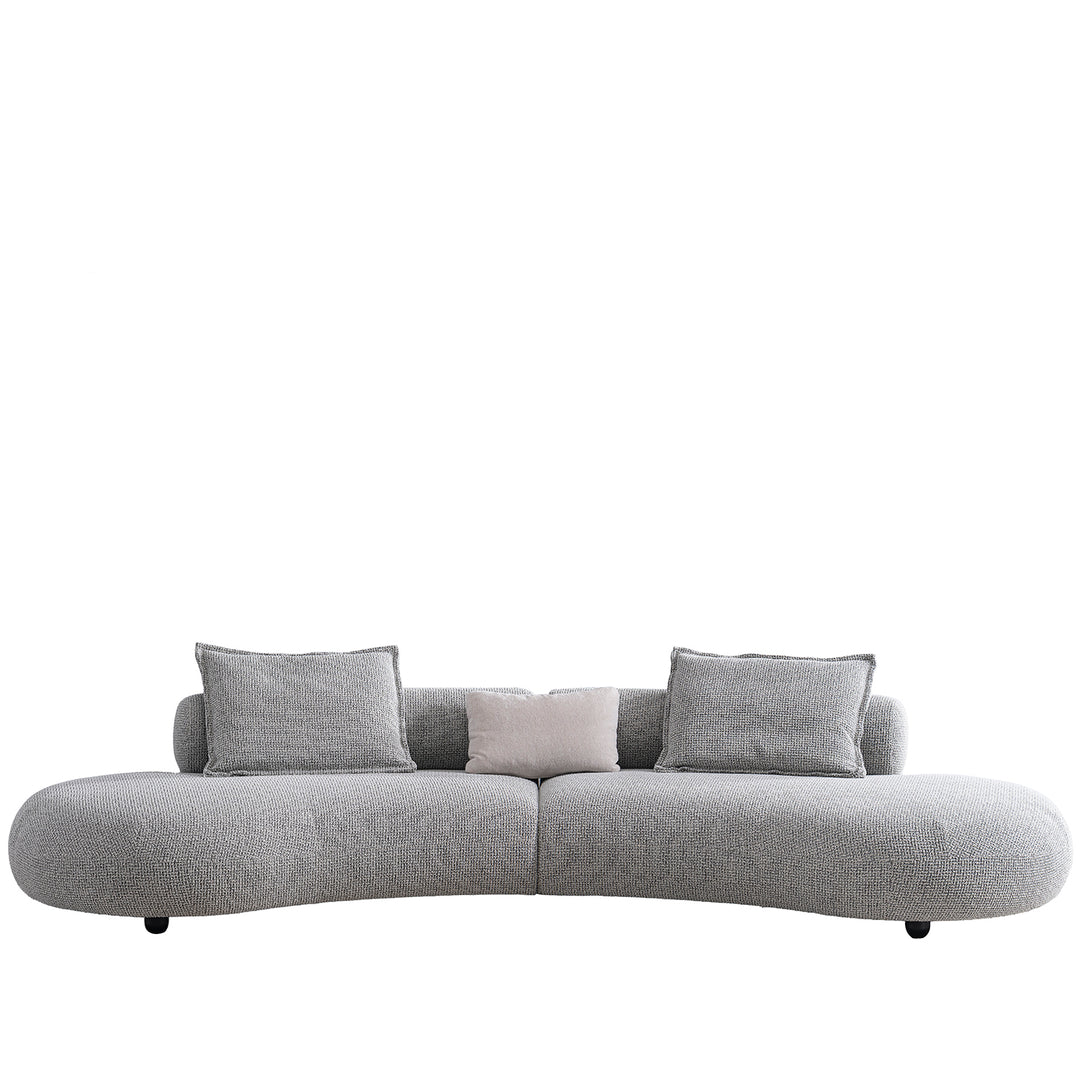 Cream mixed weave fabric 6 seater sofa curvo in white background.