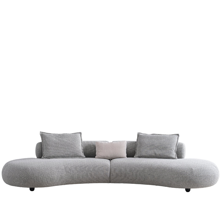 Cream mixed weave fabric 6 seater sofa curvo in white background.