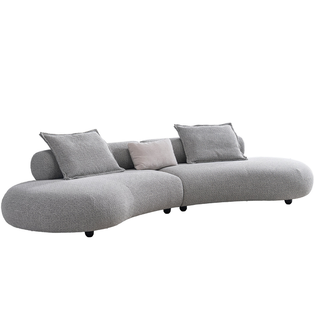 Cream mixed weave fabric 6 seater sofa curvo in real life style.