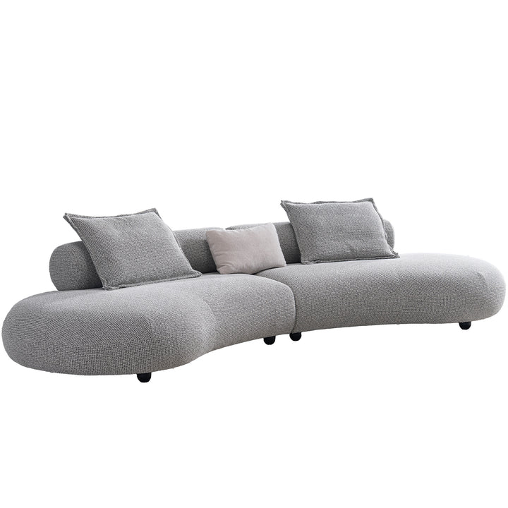 Cream mixed weave fabric 6 seater sofa curvo in real life style.