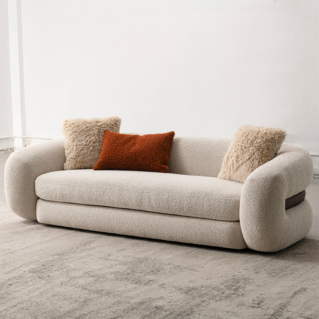 Cream boucle fabric 3 seater sofa curly in still life.