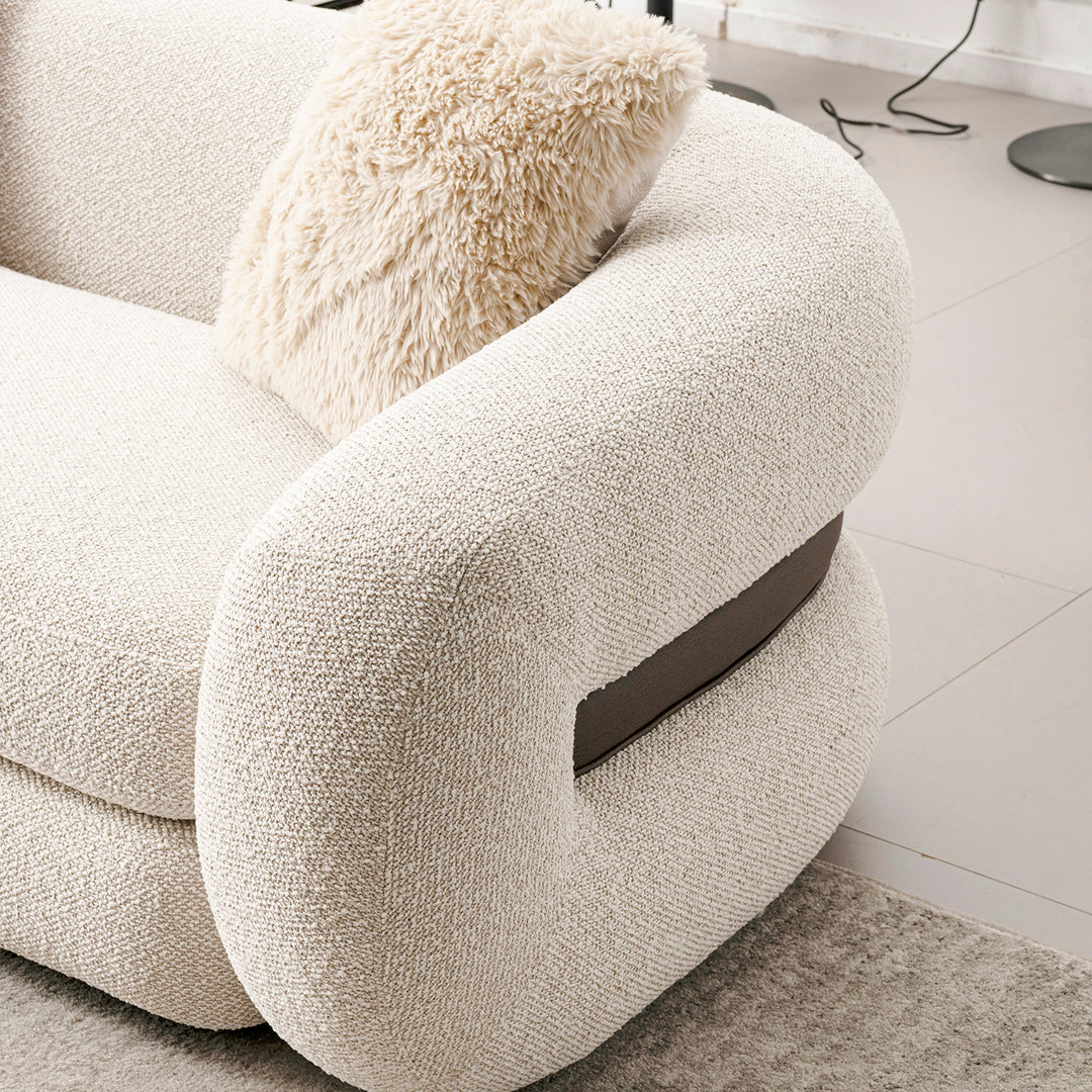 Cream boucle fabric 3 seater sofa curly with context.