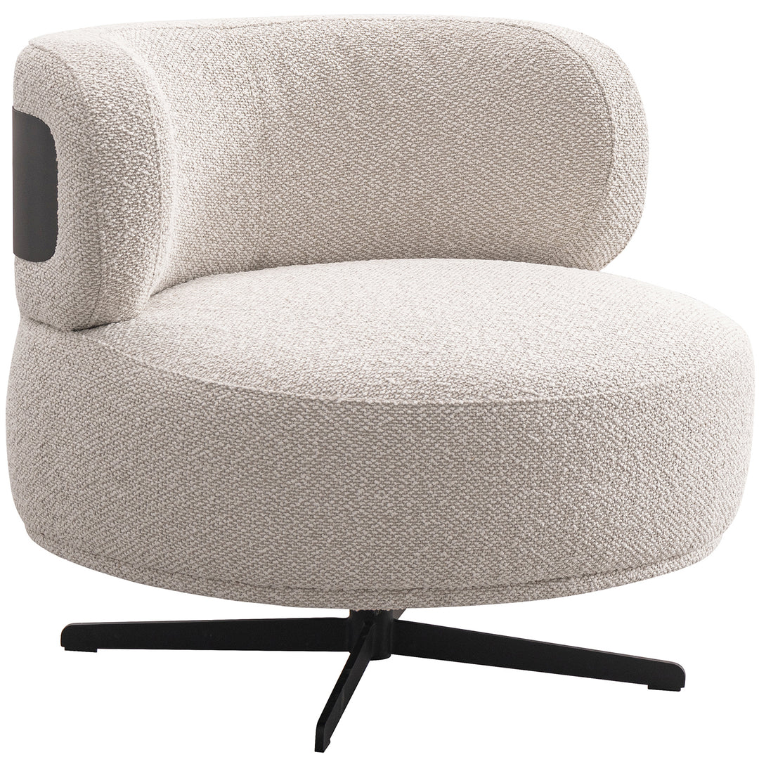 Cream boucle fabric revolving 1 seater sofa chair vuvo in white background.