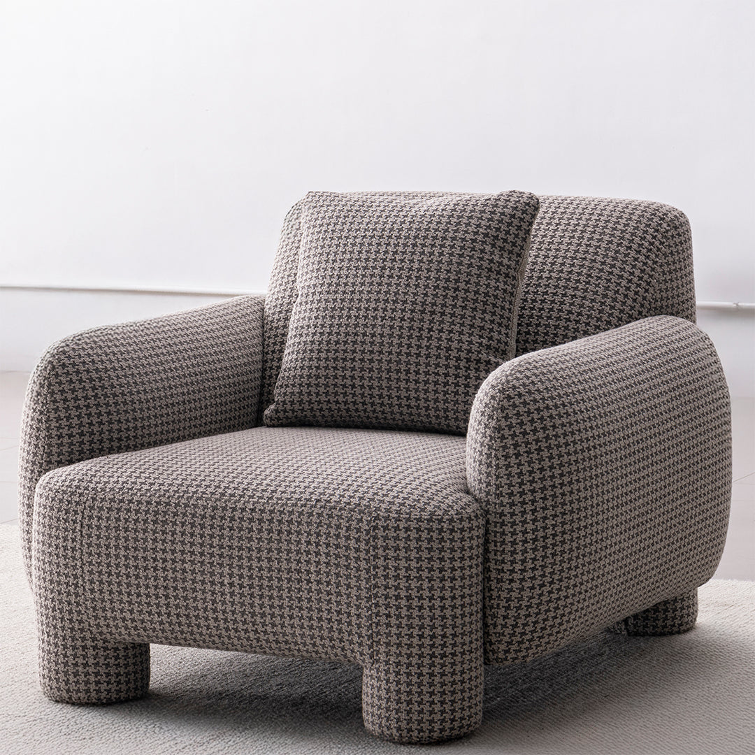 Cream mixed weave fabric 1 seater sofa syra in real life style.