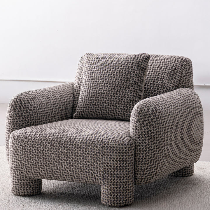 Cream mixed weave fabric 1 seater sofa syra in real life style.