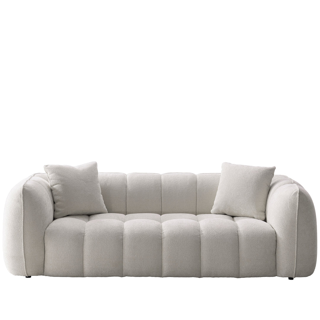 Cream mixed weave fabric 3 seater sofa puddy in white background.