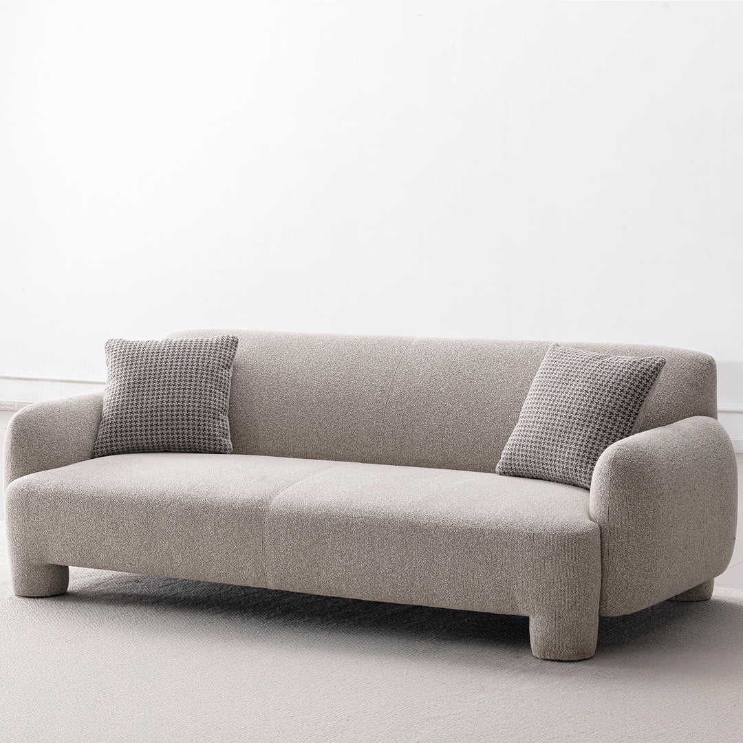 Cream mixed weave fabric 3 seater sofa syra in panoramic view.