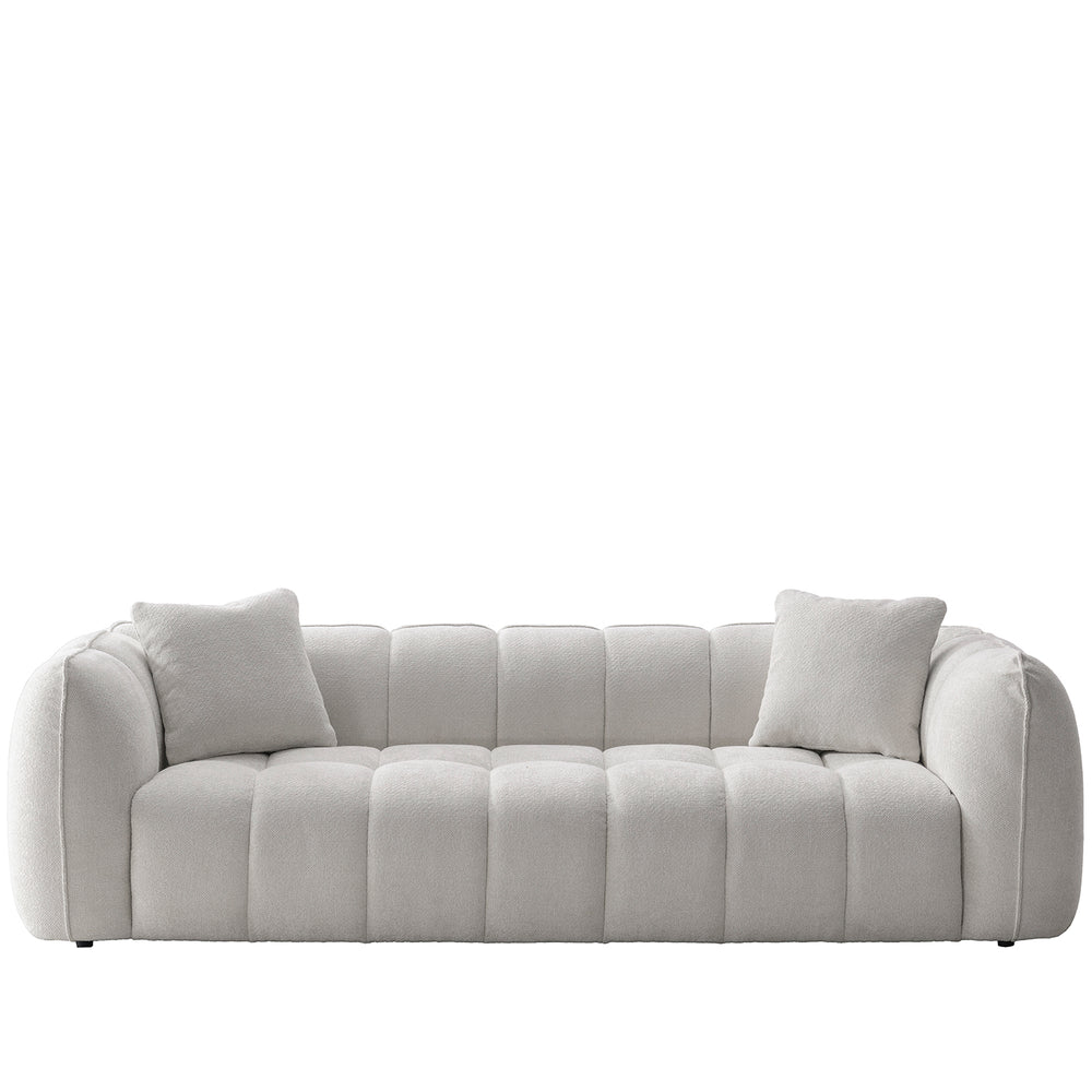 Cream mixed weave fabric 4 seater sofa puddy in white background.