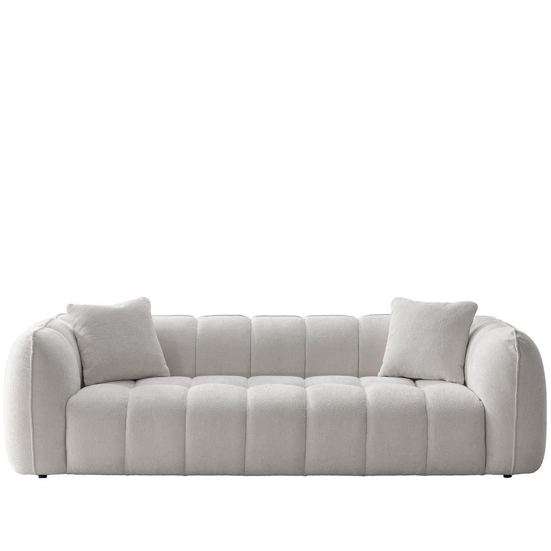 Cream mixed weave fabric 4 seater sofa puddy in white background.