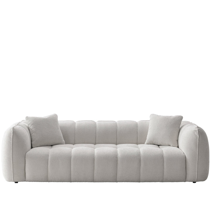 Cream mixed weave fabric 4 seater sofa puddy in white background.