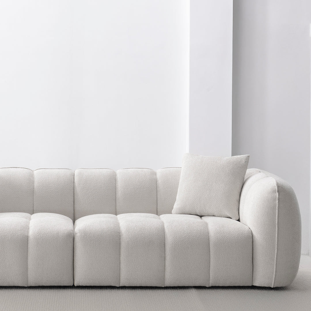 Cream mixed weave fabric 4 seater sofa puddy in panoramic view.