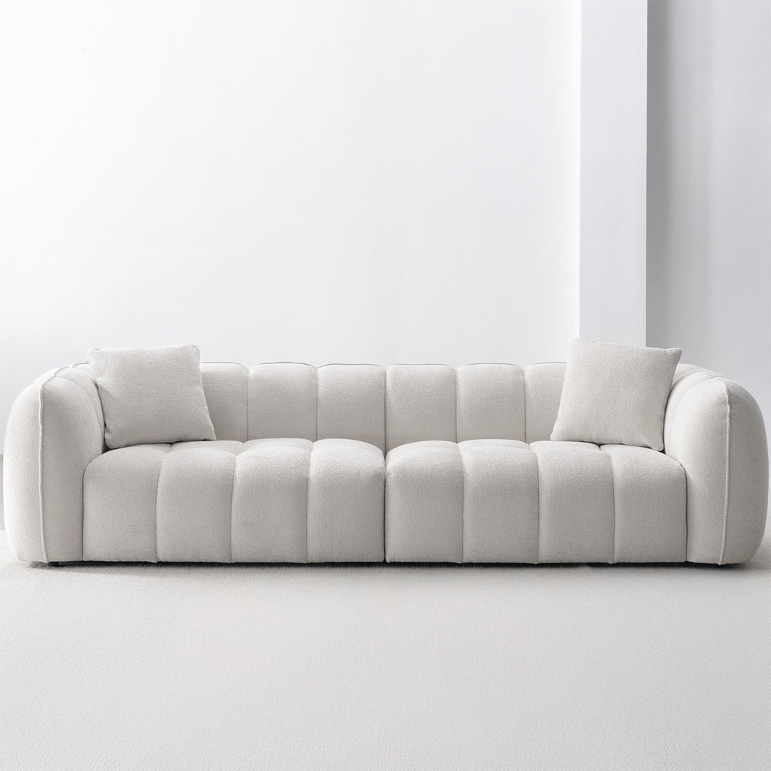 Cream mixed weave fabric 4 seater sofa puddy in still life.