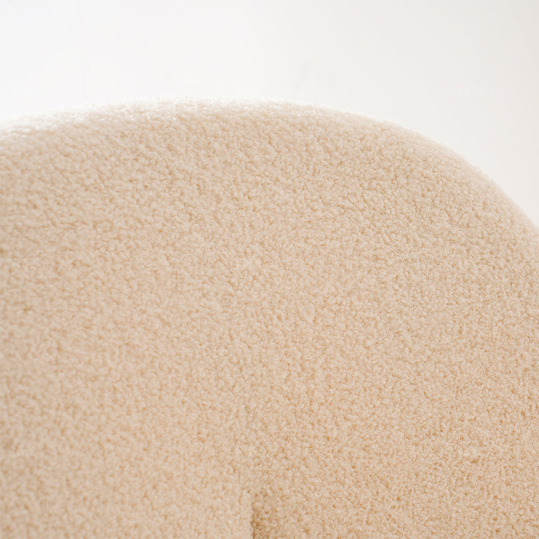 Cream boucle dining chair pavlova ii in details.
