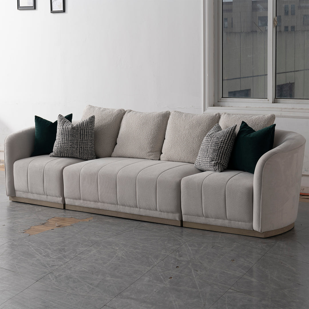 Japandi cotton fabric sectional 4 seater sofa panna in panoramic view.