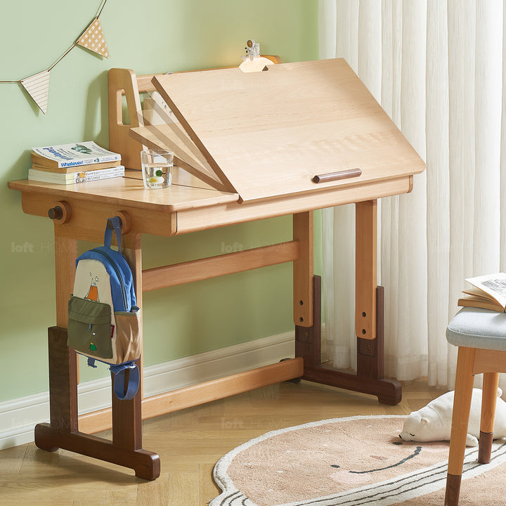 Scandinavian wood kids study table lift in real life style.
