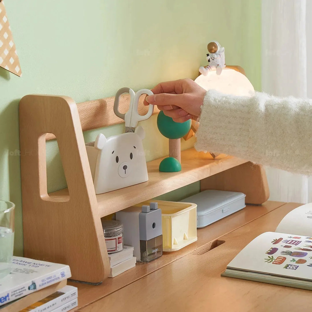 Scandinavian wood kids study table lift with context.
