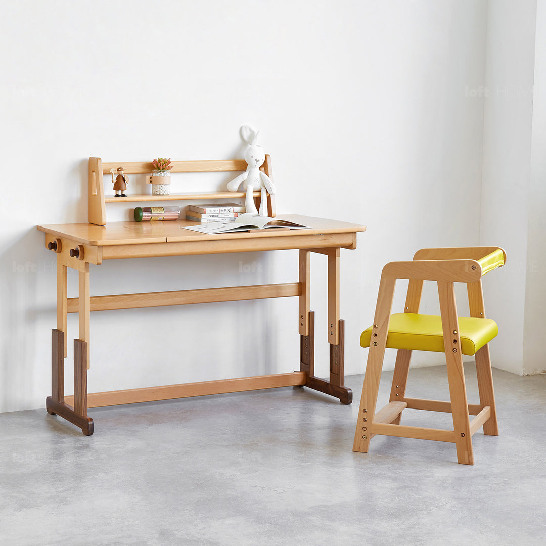 Scandinavian wood kids study table lift in close up details.