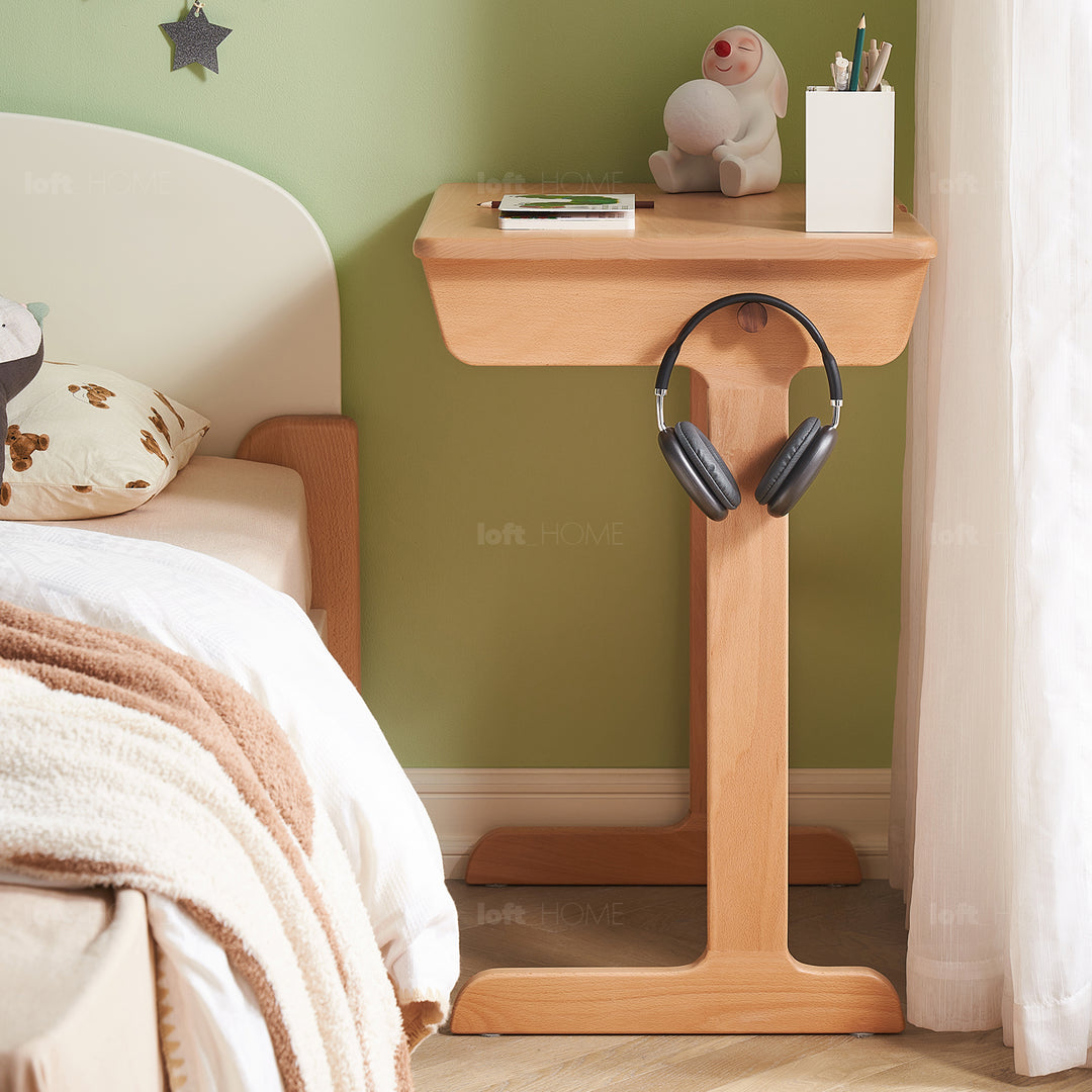 Scandinavian wood kids study table mini in close up details.