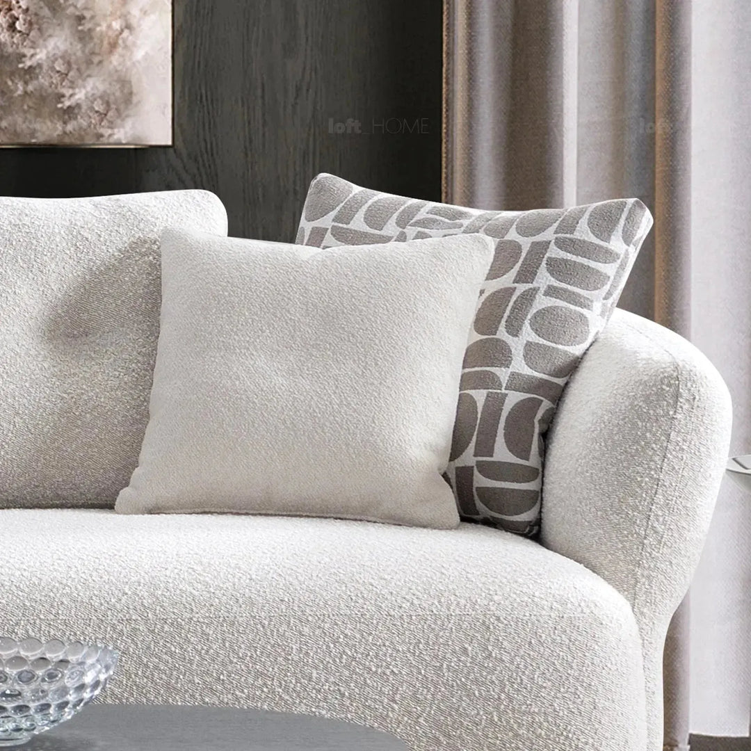 Modern boucle fabric 4 seater sofa couch in still life.
