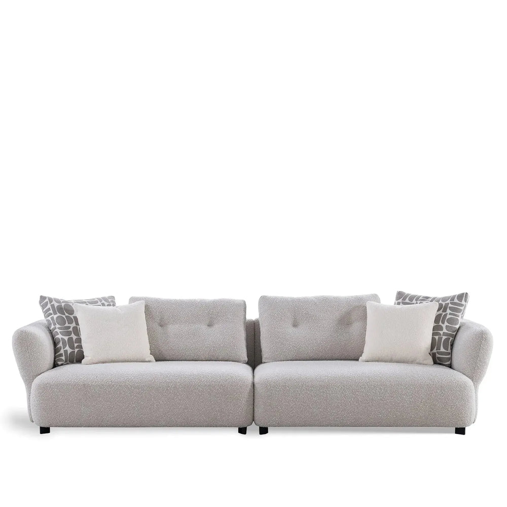 Modern boucle fabric 4 seater sofa couch in white background.