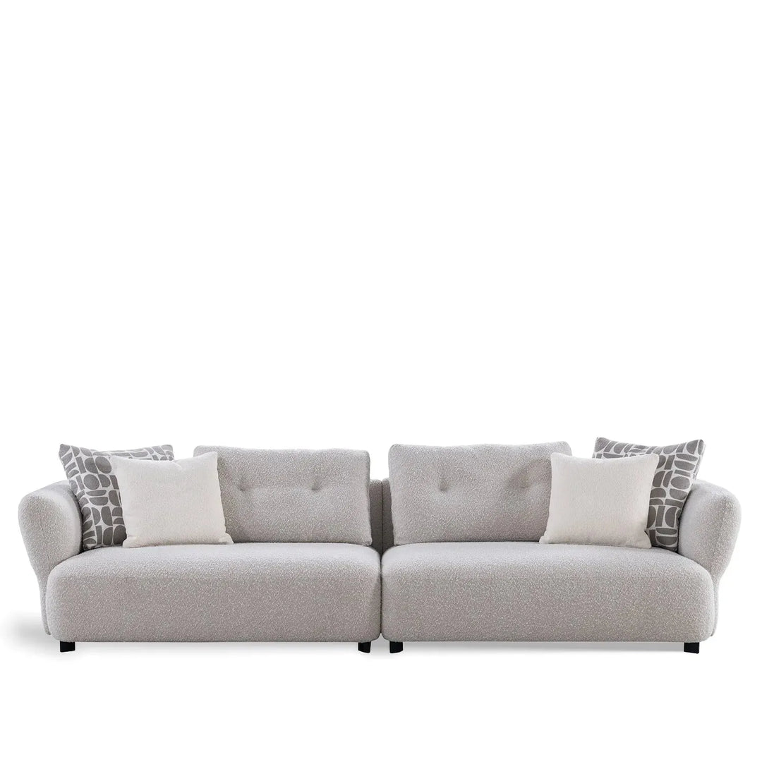 Modern boucle fabric 4 seater sofa couch in white background.