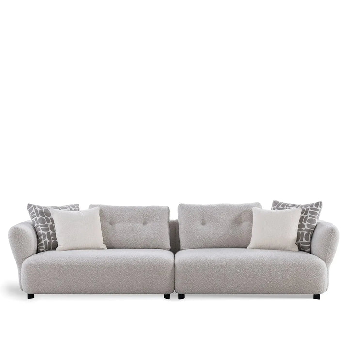 Modern boucle fabric 4 seater sofa couch in white background.