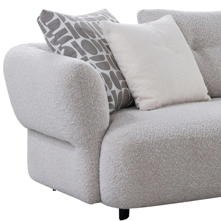Modern boucle fabric 4 seater sofa couch in real life style.